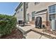 A cozy backyard patio with a dark grill and outdoor seating provides the perfect space for outdoor dining at 1329 Jacemans Way, Cornelius, NC 28031