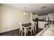 Open dining area with hardwood floors, a modern light fixture, and easy access to the kitchen at 1329 Jacemans Way, Cornelius, NC 28031