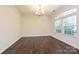 Dining room has hardwood floors, bright lighting, and a large window at 1329 Jacemans Way, Cornelius, NC 28031