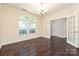 Dining room features hardwood floors, bright lighting, and French doors at 1329 Jacemans Way, Cornelius, NC 28031