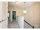 Second floor hallway with carpet and access to the bedrooms at 1329 Jacemans Way, Cornelius, NC 28031