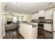 Kitchen featuring stainless steel appliances, white cabinets, and granite countertops at 1329 Jacemans Way, Cornelius, NC 28031