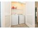 A laundry room with a white washer and dryer at 1329 Jacemans Way, Cornelius, NC 28031