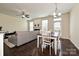 Open living space with hardwood floors and dining table at 1329 Jacemans Way, Cornelius, NC 28031