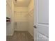 Empty walk-in closet with white wire shelving and carpeted floor, ready to store your wardrobe at 1329 Jacemans Way, Cornelius, NC 28031