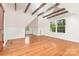 Finished attic space features wood beams, natural light, and hardwood floors at 1400 Matheson Ave, Charlotte, NC 28205