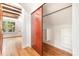 View of storage area in the attic, featuring custom shelves, hardwood floors, and closet at 1400 Matheson Ave, Charlotte, NC 28205