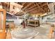 Unfinished basement with exposed beams, pipes, stairwell, storage, and painted cinder block walls at 1400 Matheson Ave, Charlotte, NC 28205