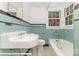 Charming bathroom with vintage tile, classic fixtures, and natural light at 1400 Matheson Ave, Charlotte, NC 28205