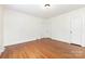 Bright bedroom with hardwood floors, white walls, and classic trim for a clean and simple design at 1400 Matheson Ave, Charlotte, NC 28205