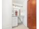 Hallway vanity with built in mirror, drawers, and vintage flooring at 1400 Matheson Ave, Charlotte, NC 28205