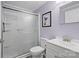 Updated bathroom with stand up shower, white vanity, toilet and purple accent wall at 144 Stoneybrook Rd, Salisbury, NC 28147