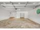 Large garage with concrete flooring and white walls, offering ample storage and workspace at 144 Stoneybrook Rd, Salisbury, NC 28147