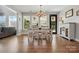 Dining area features bright windows, a modern chandelier, and an exterior door that leads outside at 1478 Imperial Ct, York, SC 29745