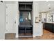 Inviting entryway features a built-in storage bench with hooks, shelves, and access to the kitchen at 1478 Imperial Ct, York, SC 29745