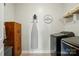 This is a laundry room with a washer and dryer, an ironing board, and storage cabinets at 1478 Imperial Ct, York, SC 29745