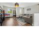 Bright living room with a cozy sectional sofa, large windows, and a fun game table at 1478 Imperial Ct, York, SC 29745