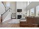 Bright living room boasts a fireplace, high ceilings, and large windows for plenty of natural light at 1478 Imperial Ct, York, SC 29745