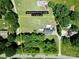 Expansive aerial view showcasing the home's placement on a generous 1.5-acre lot surrounded by mature trees at 1585 Salem Church Rd, Lincolnton, NC 28092