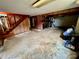 Spacious basement featuring concrete flooring and a brick fireplace at 1585 Salem Church Rd, Lincolnton, NC 28092