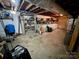 Spacious basement with exposed ceiling, work area and lots of potential storage space at 1585 Salem Church Rd, Lincolnton, NC 28092