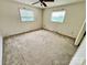 Bedroom featuring neutral colored carpet, and two windows allowing for lots of natural light at 1585 Salem Church Rd, Lincolnton, NC 28092