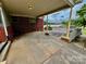 View of the brick carport with wooden deck and backyard in background at 1585 Salem Church Rd, Lincolnton, NC 28092