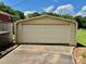 Exterior of a one car detached garage with a concrete driveway on a sunny day at 1585 Salem Church Rd, Lincolnton, NC 28092