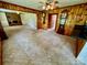 Carpeted living room with wood paneling and brick fireplace at 1585 Salem Church Rd, Lincolnton, NC 28092