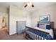 Bright bedroom with gray furniture, blue accents, and natural light at 1805 Sutter Creek Dr, Waxhaw, NC 28173