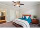Inviting bedroom featuring plush carpet, a ceiling fan, and convenient access to a full bathroom at 1805 Sutter Creek Dr, Waxhaw, NC 28173