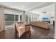 Bright dining area with sliding glass doors leading to a porch and open view of the living room at 1805 Sutter Creek Dr, Waxhaw, NC 28173