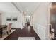 Welcoming entry hallway with dark wood floors and decorative wainscoting at 1805 Sutter Creek Dr, Waxhaw, NC 28173