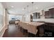 Open kitchen boasts granite counters, dark cabinetry, and an island with seating and pendant lighting at 1805 Sutter Creek Dr, Waxhaw, NC 28173