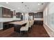 Large kitchen island with modern pendant lighting and stainless steel appliances at 1805 Sutter Creek Dr, Waxhaw, NC 28173