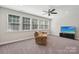 Inviting living room featuring a comfortable reclining sofa and a large TV at 1805 Sutter Creek Dr, Waxhaw, NC 28173