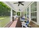 Spacious covered porch, perfect for outdoor entertaining, with seating, wood floors, and outdoor lighting at 1805 Sutter Creek Dr, Waxhaw, NC 28173