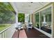 Covered porch with outdoor seating, wood floors and outdoor string lights, perfect for relaxation at 1805 Sutter Creek Dr, Waxhaw, NC 28173