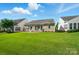 View of the backyard featuring a patio, exterior of the home, and green grass at 1974 Links View Dr, Fort Mill, SC 29707