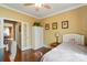Bright bedroom featuring hardwood floors, a ceiling fan, a day bed, a closet, and natural light at 1974 Links View Dr, Fort Mill, SC 29707