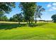 Lush green golf course under a blue sky with scattered clouds at 1974 Links View Dr, Fort Mill, SC 29707
