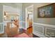 View from the hallway showcasing hardwood floors and trimmed doorways into multiple rooms at 1974 Links View Dr, Fort Mill, SC 29707
