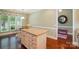 Kitchen island with drawers and granite countertop plus a breakfast nook with bright natural light at 1974 Links View Dr, Fort Mill, SC 29707
