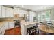 Bright kitchen with white cabinetry, granite countertops, a center island, and stainless steel appliances at 1974 Links View Dr, Fort Mill, SC 29707