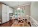 Eat-in kitchen area with white table set, large window, and built-in workstation at 1974 Links View Dr, Fort Mill, SC 29707