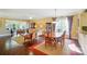 Spacious living room with hardwood floors, and ample natural light, open to the dining area at 1974 Links View Dr, Fort Mill, SC 29707