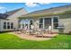 Outdoor patio with a brick base, complete with patio furniture and a grill at 1974 Links View Dr, Fort Mill, SC 29707