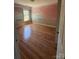 This bedroom features wood flooring, a large window, and a hand-painted mural on the wall at 20807 Willow Pond Rd, Cornelius, NC 28031