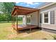 Back deck with wood pergola and sliding glass doors leading to the home at 233 Sellars Rd, Kings Mountain, NC 28086