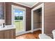 Bathroom with modern sink, hardwood floors, and window with backyard view at 233 Sellars Rd, Kings Mountain, NC 28086
